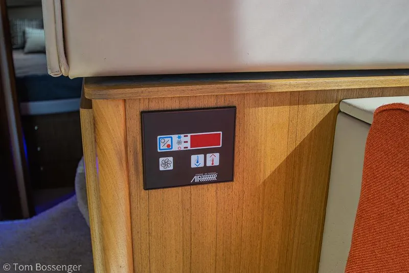 Slide: The Image of Control panel on 2001 Bayliner 3788 Command Bridge Motoryacht interior, featuring wood finish. - 27