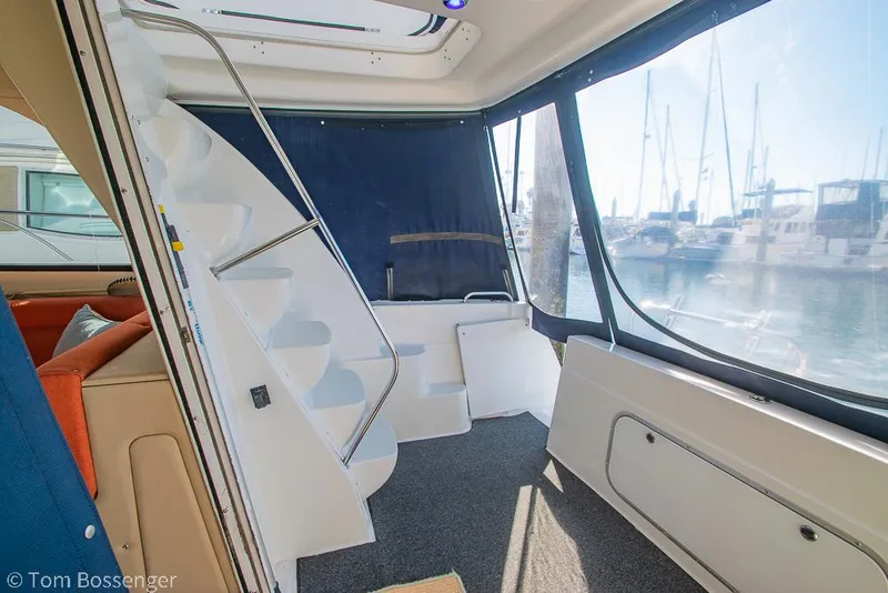 Slide: The Image of Interior of 2001 Bayliner 3788 Command Bridge Motoryacht with staircase and marina view. - 35