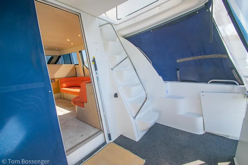 Slide: The Image of 2001 Bayliner 3788 Command Bridge Motoryacht interior with stairs and seating area. - 36