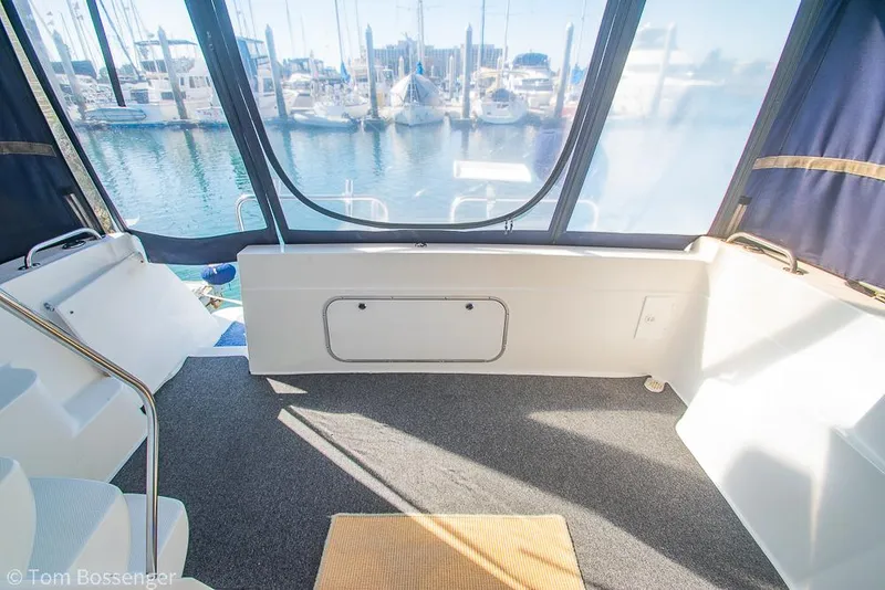 Slide: The Image of Bayliner 3788 Command Bridge Motoryacht 2001 interior with marina view through large windows. - 37