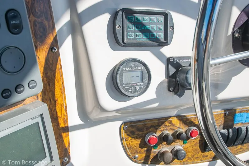 Slide: The Image of Control panel of a 2001 Bayliner 3788 Command Bridge Motoryacht with steering wheel and instruments. - 42