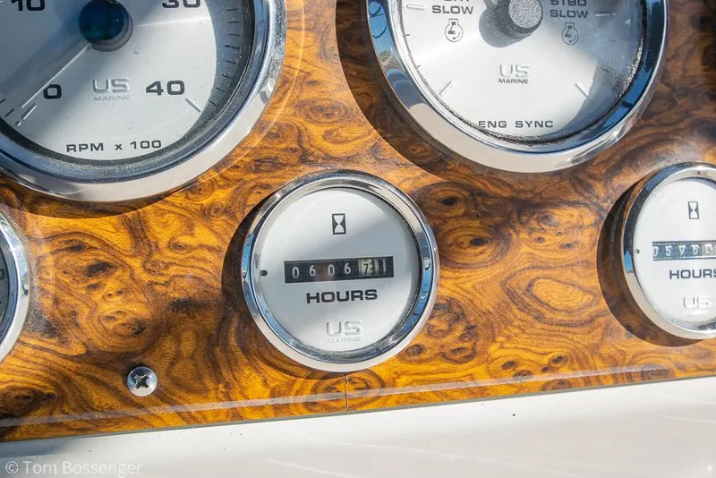 Slide: The Image of Close-up of 2001 Bayliner 3788 yacht dashboard with wood finish and gauges. - 46