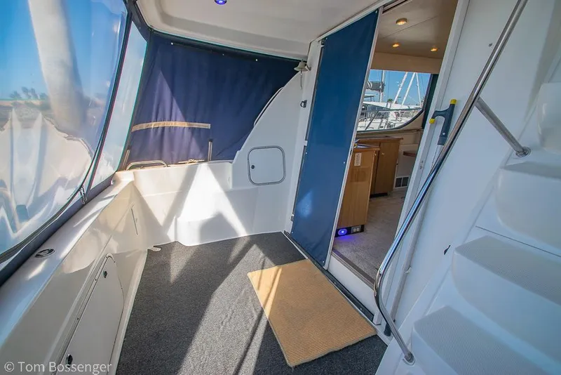 Slide: The Image of 2001 Bayliner 3788 Command Bridge Motoryacht interior with carpeted deck and open cabin door. - 5