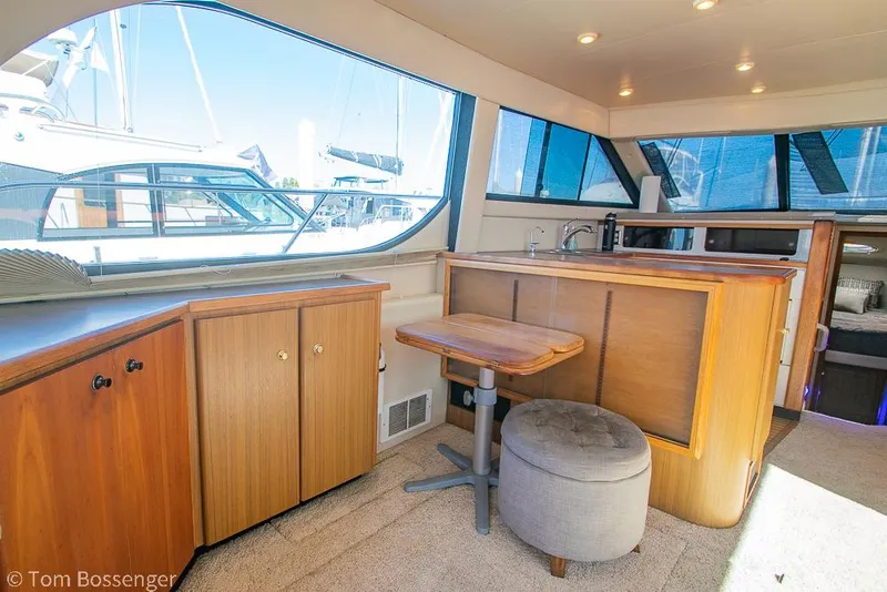 Slide: The Image of Interior of 2001 Bayliner 3788 Command Bridge Motoryacht with wood cabinetry and seating. - 8