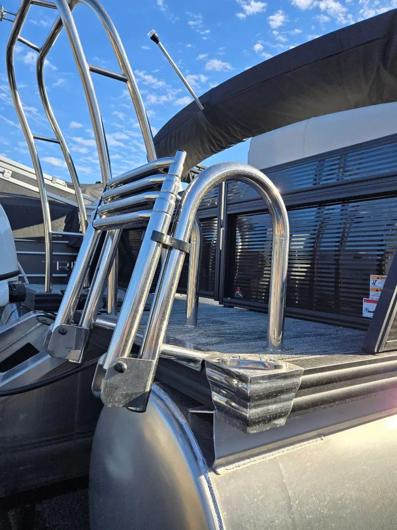 Slide: The Image of 2025 Quest L Class 20RLS boat ladder and deck under blue sky. - 4