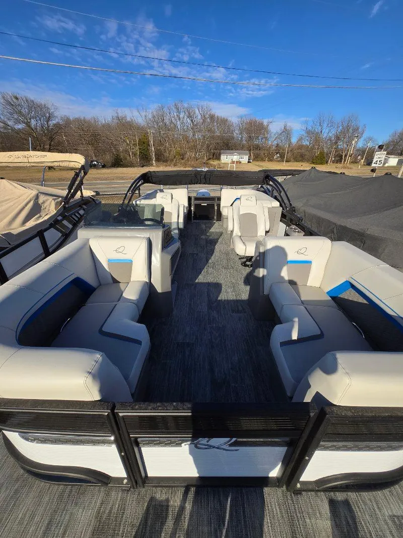 Slide: The Image of 2025 Quest L Class 20RLS pontoon boat with spacious seating and modern design. - 5