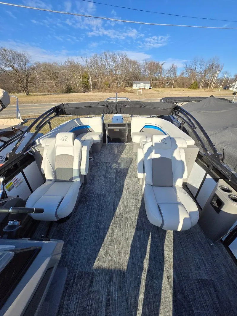 Slide: The Image of 2025 Quest L Class 20RLS boat interior with modern seating and open layout. - 9