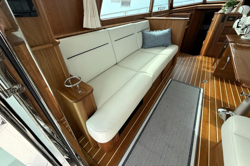 Slide: The Image of Luxurious interior of 2025 Sabre 45 Salon Express yacht with elegant seating and wood finish. - 13