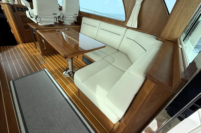 Slide: The Image of Luxurious interior of 2025 Sabre 45 Salon Express with elegant seating and wooden finishes. - 15