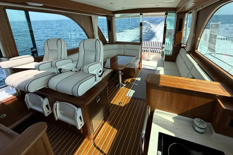 Slide: The Image of Luxurious interior of 2025 Sabre 45 Salon Express yacht with elegant seating and ocean view. - 17