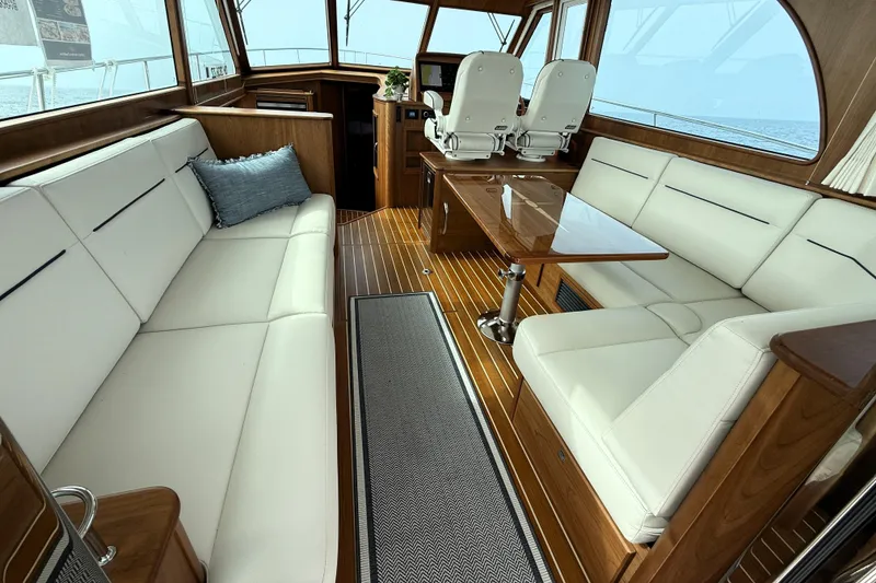 Slide: The Image of Luxurious interior of 2025 Sabre 45 Salon Express yacht with elegant seating and wooden finishes. - 2