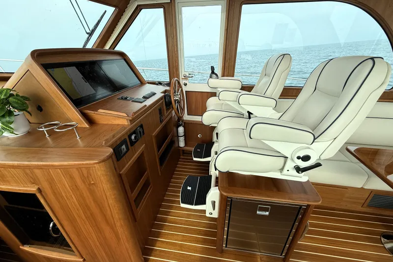 Slide: The Image of Luxurious interior of 2025 Sabre 45 Salon Express yacht with leather seating and wooden accents. - 3