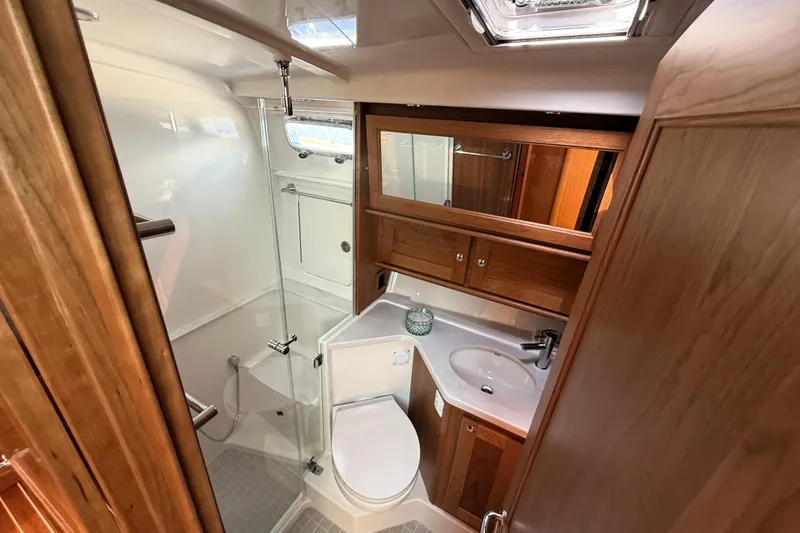 Slide: The Image of Luxurious bathroom in 2025 Sabre 45 Salon Express yacht with wood accents and modern fixtures. - 30