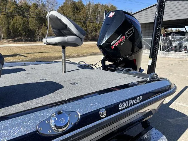Slide: The Image of 2021 Phoenix 920 PRO XP boat with Mercury engine, outdoor setting. - 15
