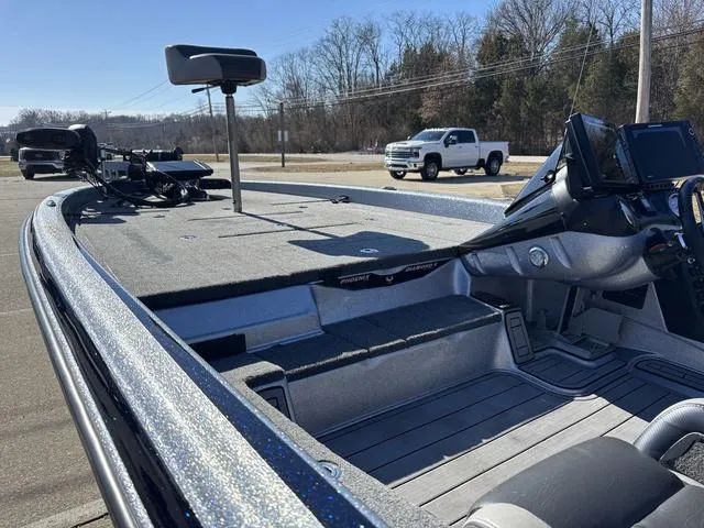 Slide: The Image of 2021 Phoenix 920 PRO XP boat interior with fishing equipment and control panel. - 16