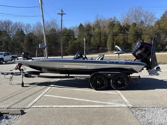 Slide: The Image of 2021 Phoenix 920 PRO XP boat on trailer, parked outdoors, side view. - 17