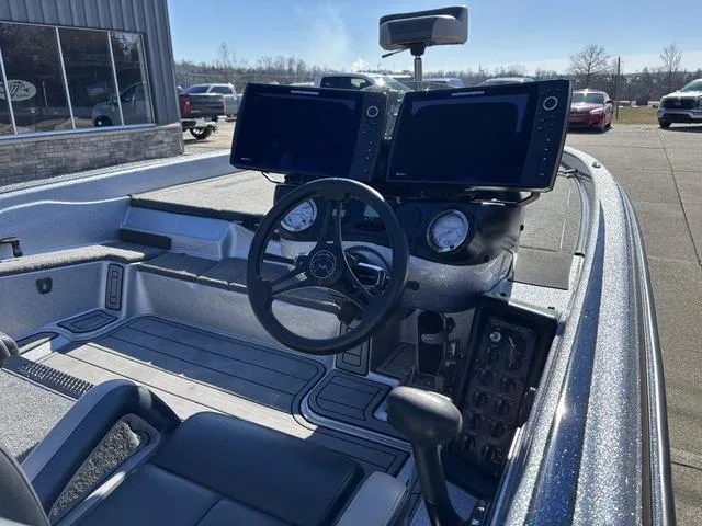 Slide: The Image of 2021 Phoenix 920 PRO XP boat cockpit with dual screens and steering wheel. - 6