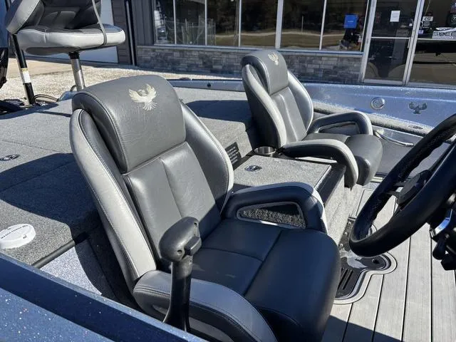 Slide: The Image of 2021 Phoenix 920 PRO XP boat interior with dual gray leather seats. - 7