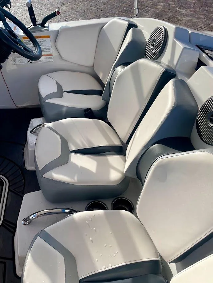 Slide: The Image of 2017 Scarab 165 HO boat interior with white and gray seating. - 10