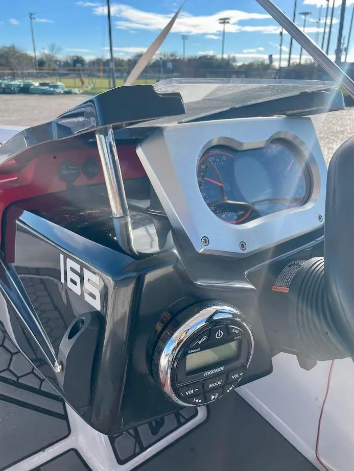 Slide: The Image of 2017 Scarab 165 HO dashboard with controls and gauges in sunlight. - 13