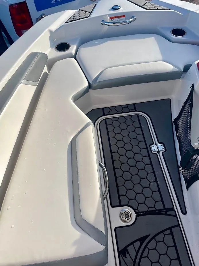 Slide: The Image of 2017 Scarab 165 HO boat interior with hexagonal pattern flooring and seating. - 15