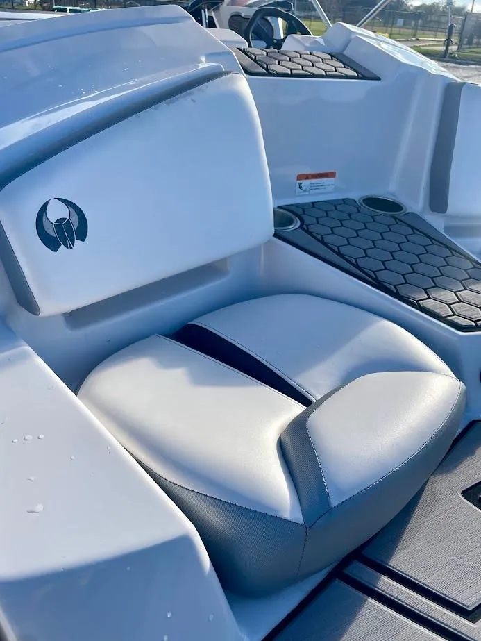 Slide: The Image of 2017 Scarab 165 HO boat interior with cushioned seating and modern design. - 18