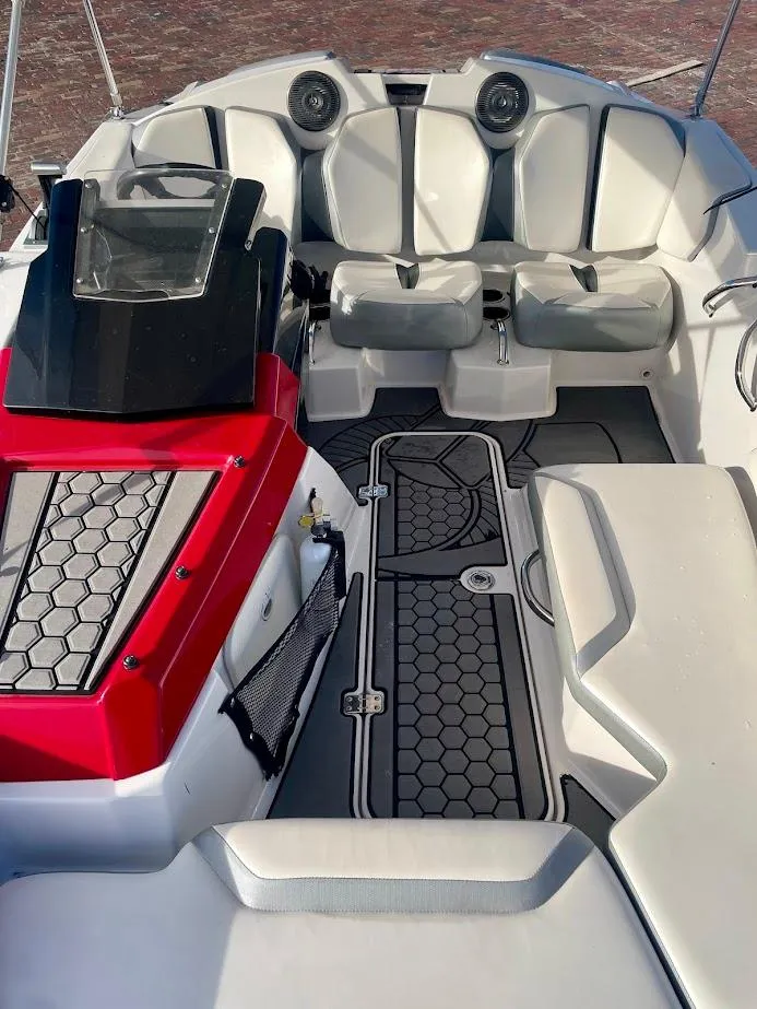 Slide: The Image of 2017 Scarab 165 HO boat interior with modern seating and stylish design. - 7