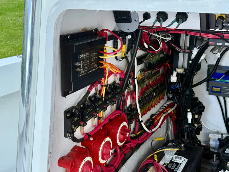 Slide: The Image of Electrical wiring and components inside a 2014 Conch 27 CC boat. - 13