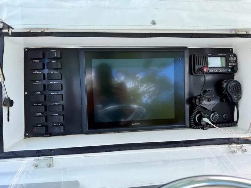 Slide: The Image of Control panel of 2014 Conch 27 CC boat with Garmin display and radio equipment. - 6