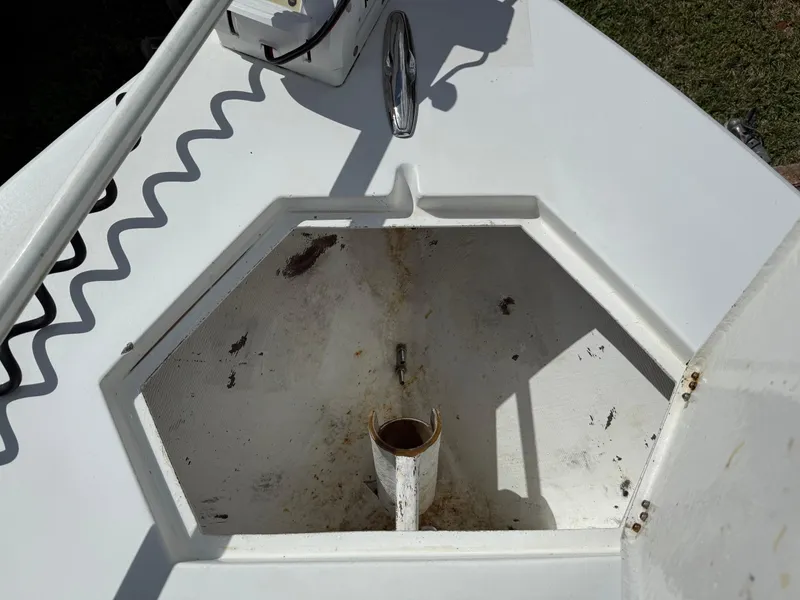 Slide: The Image of Anchor locker of 2014 Conch 27 CC boat, showing storage compartment. - 8