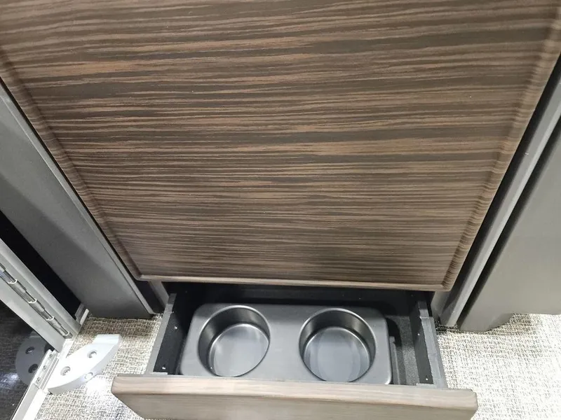 Slide: The Image of Cup holder drawer in 2025 Bennington M Swingback 24 MSB boat interior. - 13