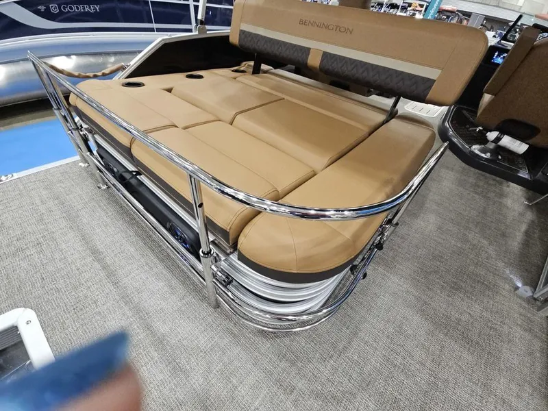 Slide: The Image of 2025 Bennington M Swingback 24 MSB boat seating with tan upholstery and chrome railing. - 9