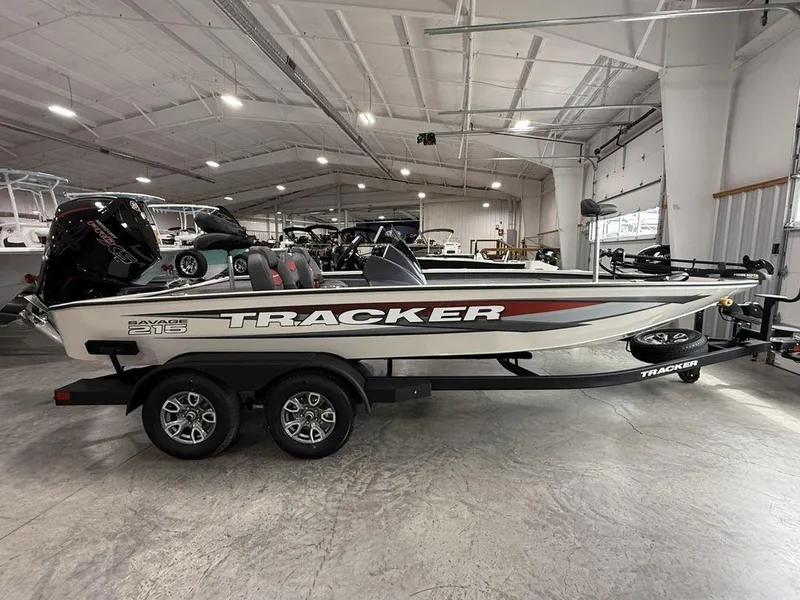 The Image of 2025 Tracker Savage 215 boat in showroom, side view, on trailer. - 1