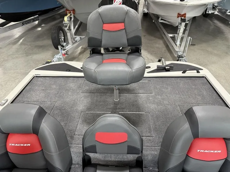 Slide: The Image of 2025 Tracker Savage 215 boat interior with gray and red seating. - 13
