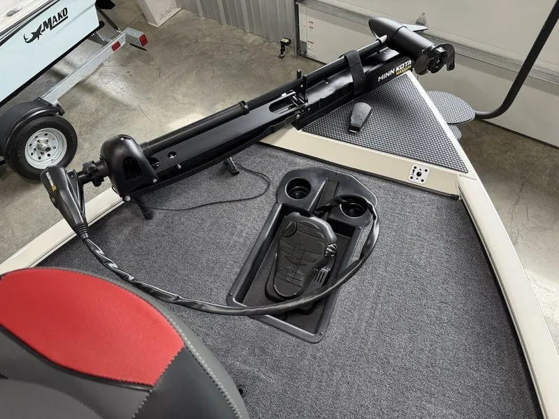 Slide: The Image of 2025 Tracker Savage 215 boat interior with trolling motor and control panel. - 5