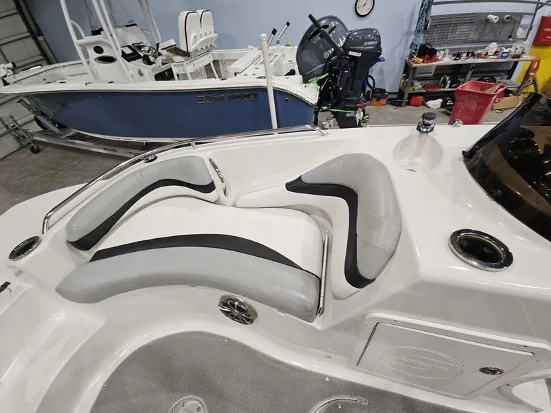 Slide: The Image of 2014 Starcraft Limited IO 2000 I/O boat interior with cushioned seating. - 10