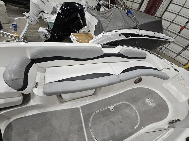 Slide: The Image of 2014 Starcraft Limited IO 2000 I/O boat interior with gray and white seating. - 14