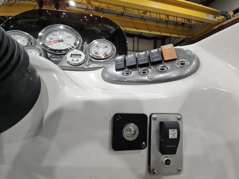 Slide: The Image of Dashboard of 2014 Starcraft Limited IO 2000 I/O boat with gauges and switches. - 17