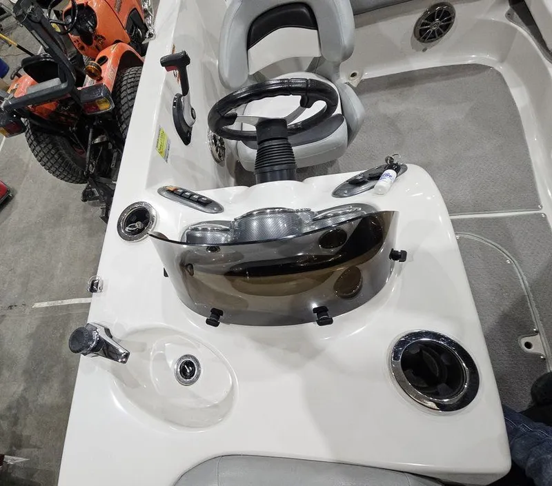 Slide: The Image of 2014 Starcraft Limited IO 2000 I/O boat dashboard with steering wheel and controls. - 18