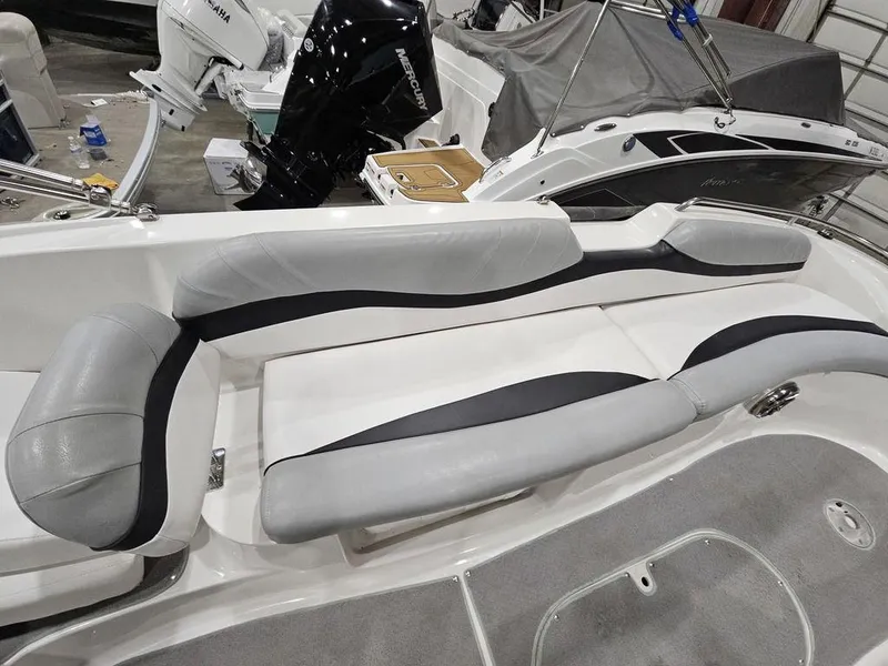 Slide: The Image of 2014 Starcraft Limited IO 2000 I/O boat interior with gray seating and modern design. - 9