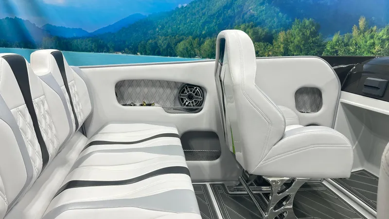Slide: The Image of 2025 Essex Boats 28 Fusion interior with white seating and scenic lake view. - 5