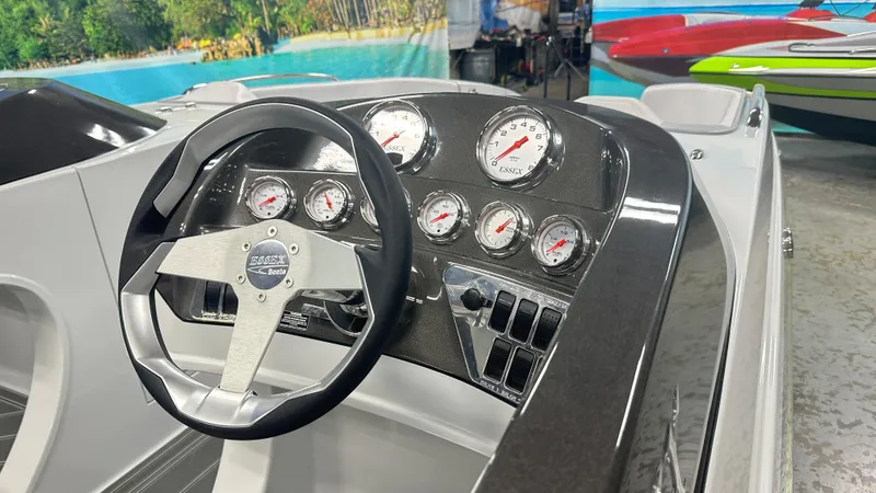 Slide: The Image of Steering console of 2025 Essex Boats 28 Fusion with gauges and controls. - 6