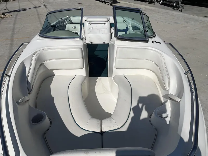 Slide: The Image of 1997 Sea Ray 185 boat interior with white seating and open windshield. - 8