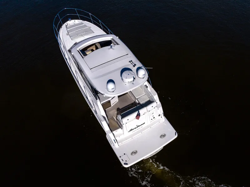 Slide: The Image of Aerial view of 2021 Regal 38 Grande Coupe yacht cruising on dark water. - 28