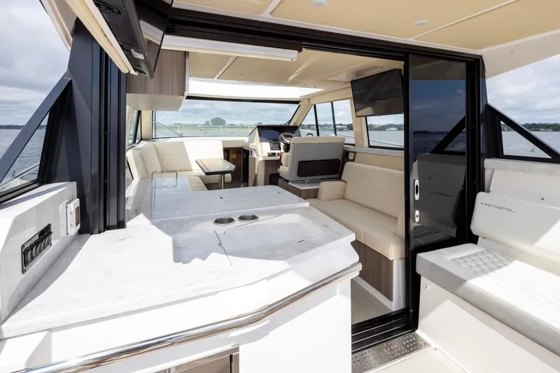 Slide: The Image of Interior of 2021 Regal 38 Grande Coupe yacht with luxurious seating and modern design. - 44