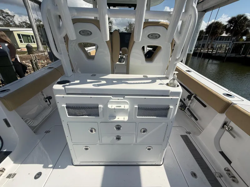 Slide: The Image of 2023 Sportsman Open 282 Center Console boat interior with seating and storage compartments. - 18