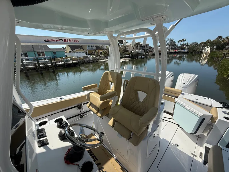 Slide: The Image of 2023 Sportsman Open 282 Center Console boat interior with dual seats and steering wheel. - 42
