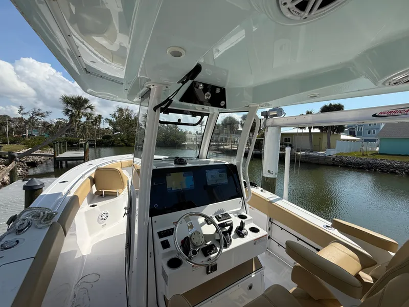 Slide: The Image of 2023 Sportsman Open 282 Center Console boat interior with modern helm and seating. - 41