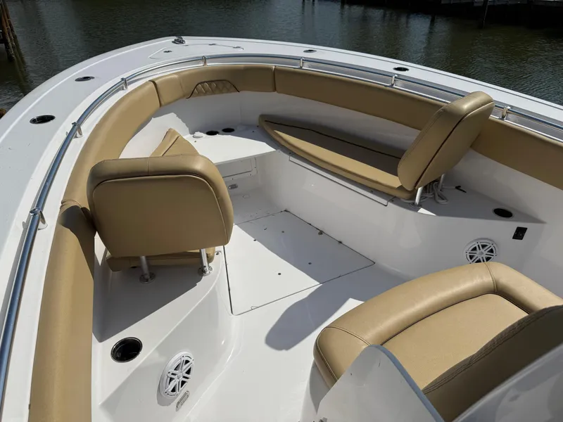 Slide: The Image of 2023 Sportsman Open 282 Center Console boat with tan seating and spacious deck. - 50
