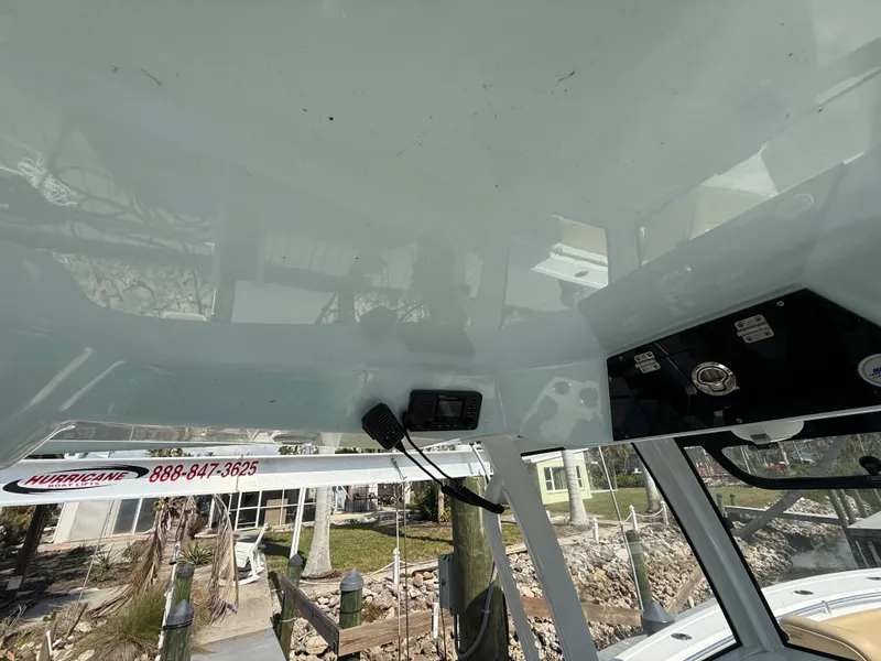 Slide: The Image of 2023 Sportsman Open 282 Center Console interior view with control panel and outdoor scenery. - 37